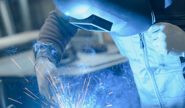 welder working in manufacture production plant